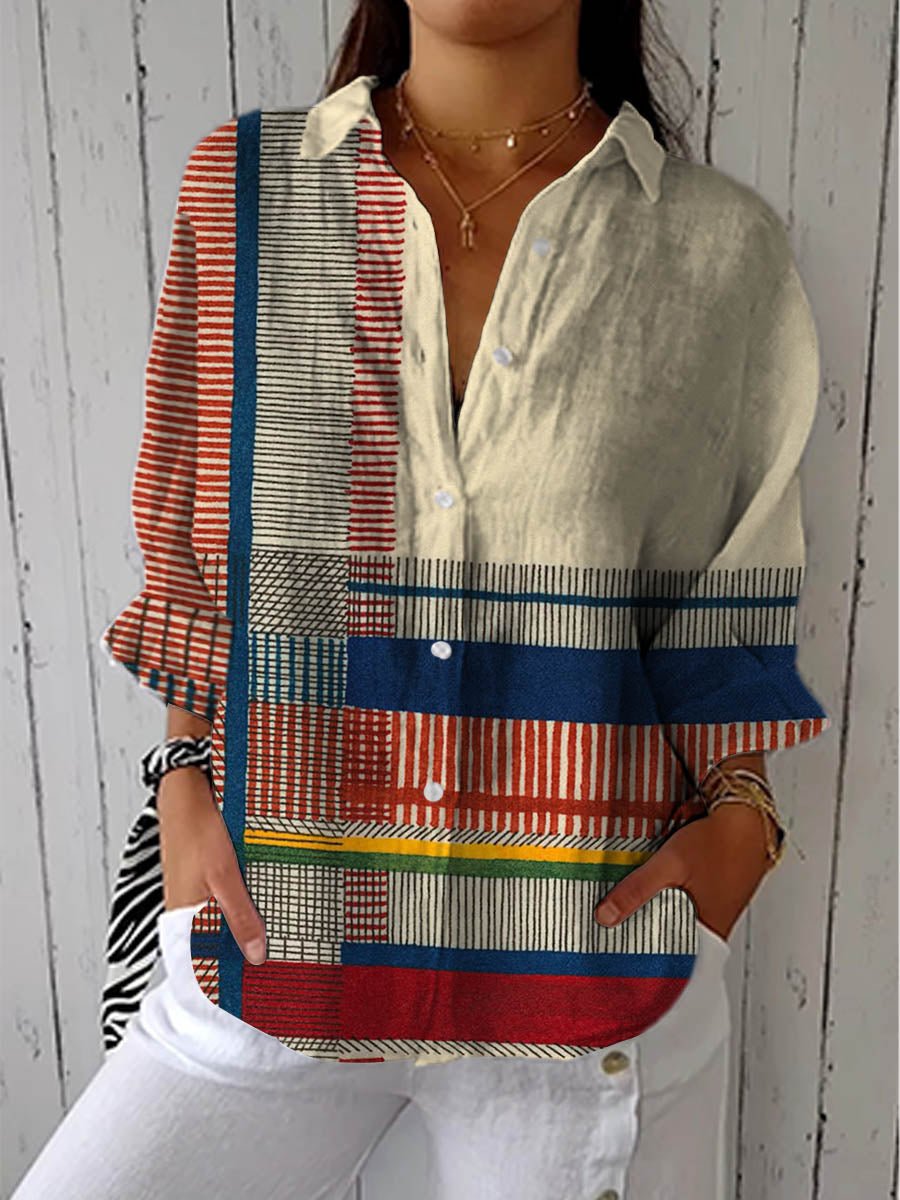 Women's relaxed geometric print button-front blouse with V-neck. Contemporary casual fashion top, modern design.