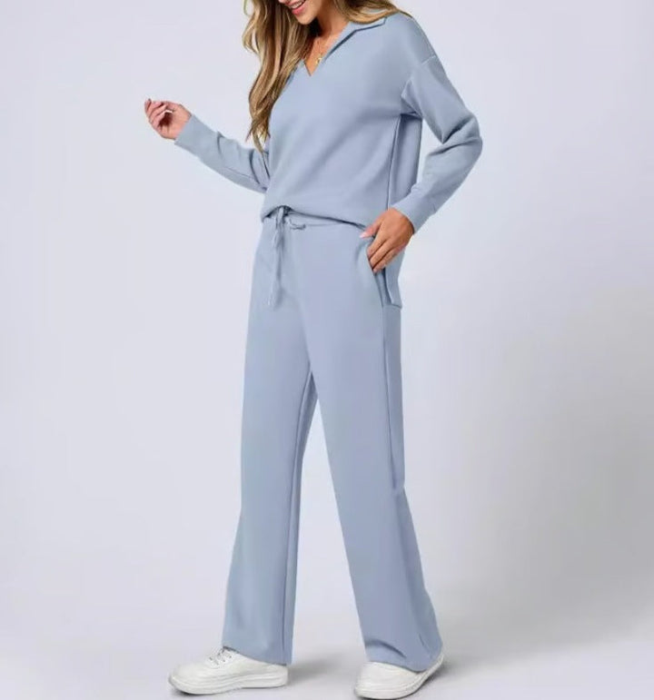 Relaxed women's two-piece set, featuring a v-neck top & wide leg lounge pants. Great for travel and casual comfort.