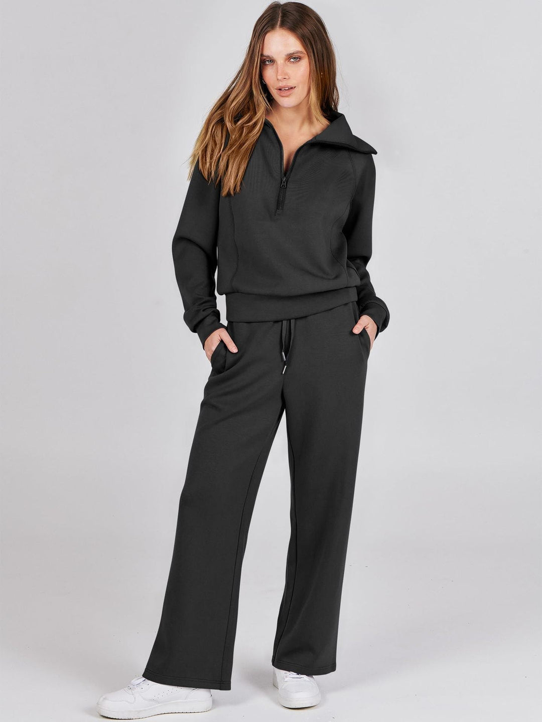 Women's relaxed two-piece zip-neck top & wide-leg casual set. Comfortable loungewear.
