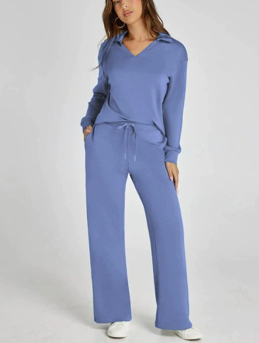 Women's two-piece leisure set. Relaxed zip-neck top and flowy wide-leg pants for comfort.
