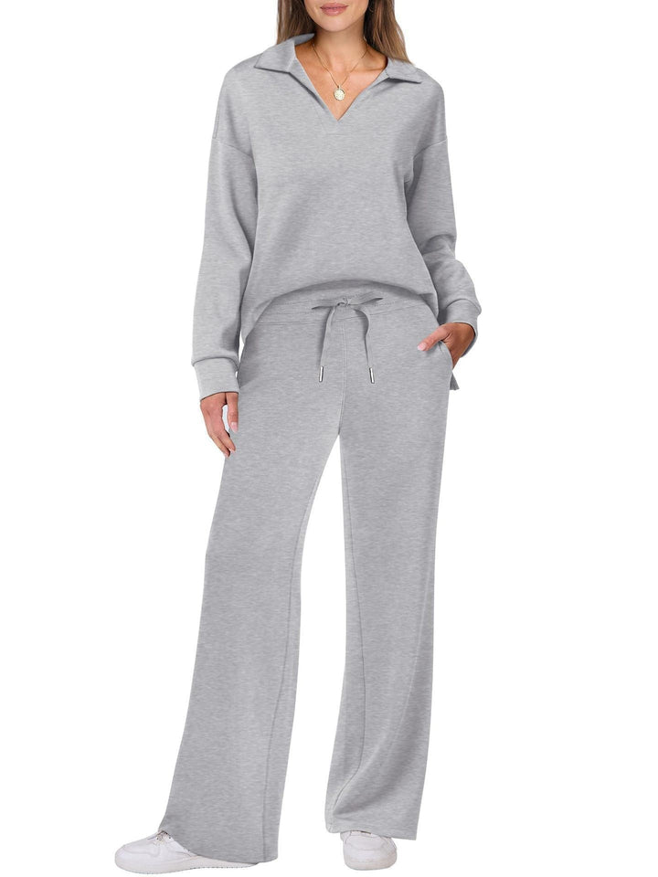 Relaxed fit women's two-piece set. Zip-neck top & wide-leg pants, perfect for active or lounge.