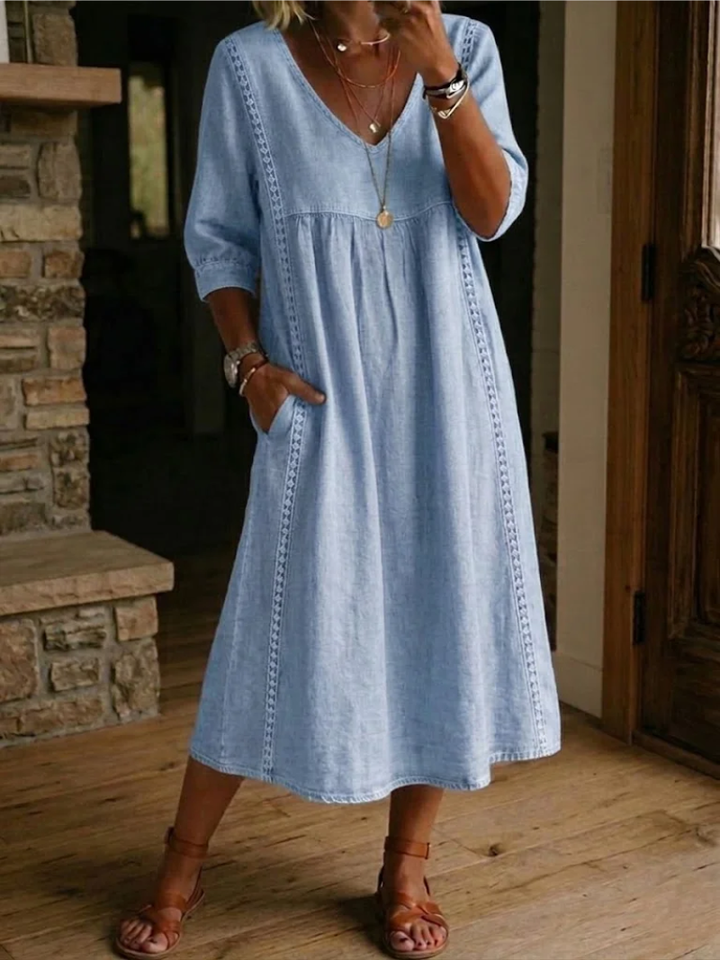 Versatile women's V-neck midi dress in a relaxed fit. Ideal comfortable everyday wear for casual spring and summer fashion.