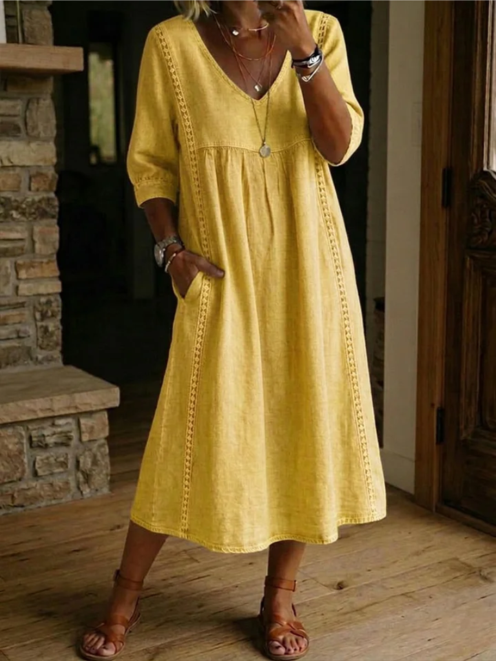 Chic women's relaxed V-neck midi dress. Perfect casual summer fashion or spring style, offering comfort and versatility.