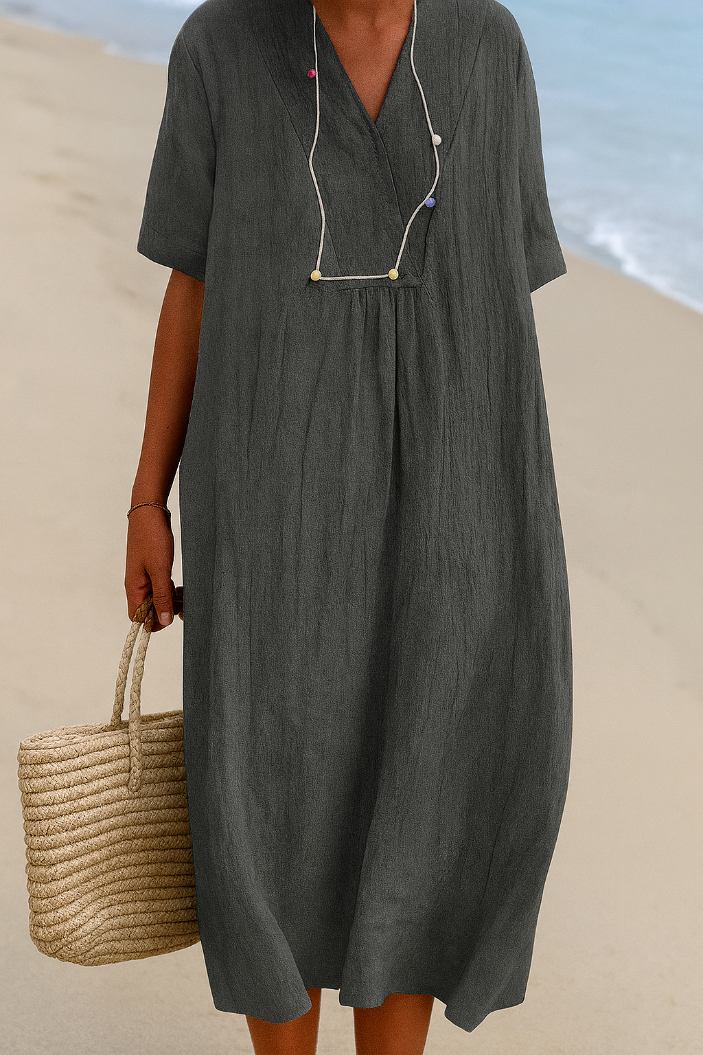 Women's relaxed V-neck short sleeve beach dress for summer vacation, lightweight casual resort wear.