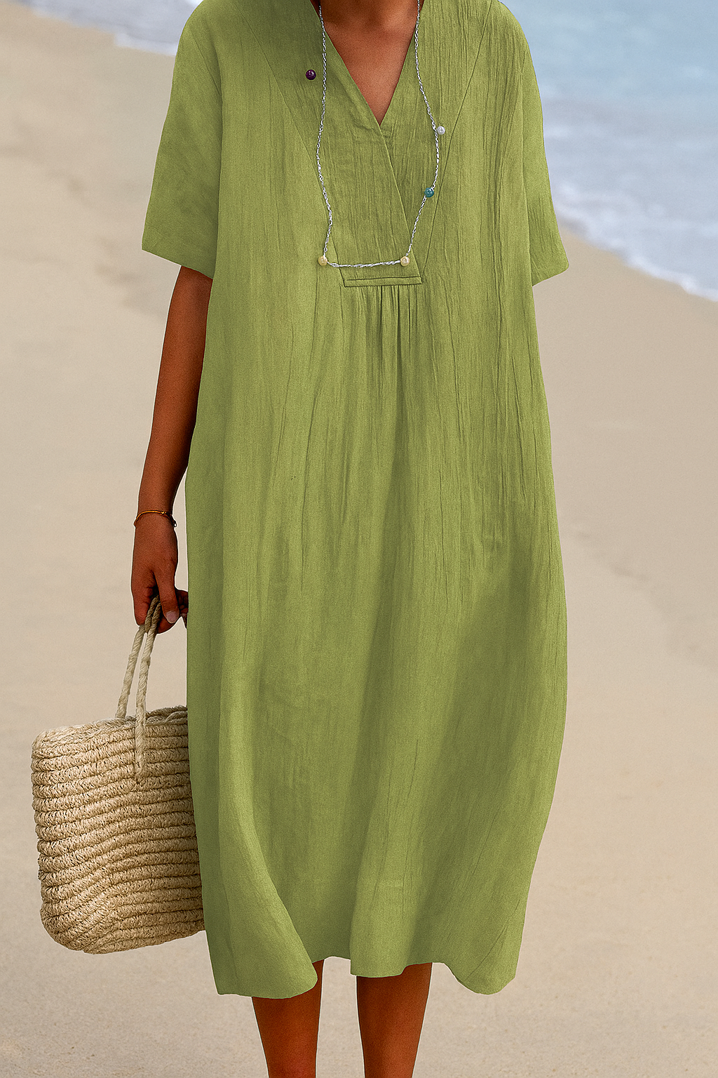 Front view of women's V-neck short sleeve beach dress, a relaxed fit summer vacation and resort wear.