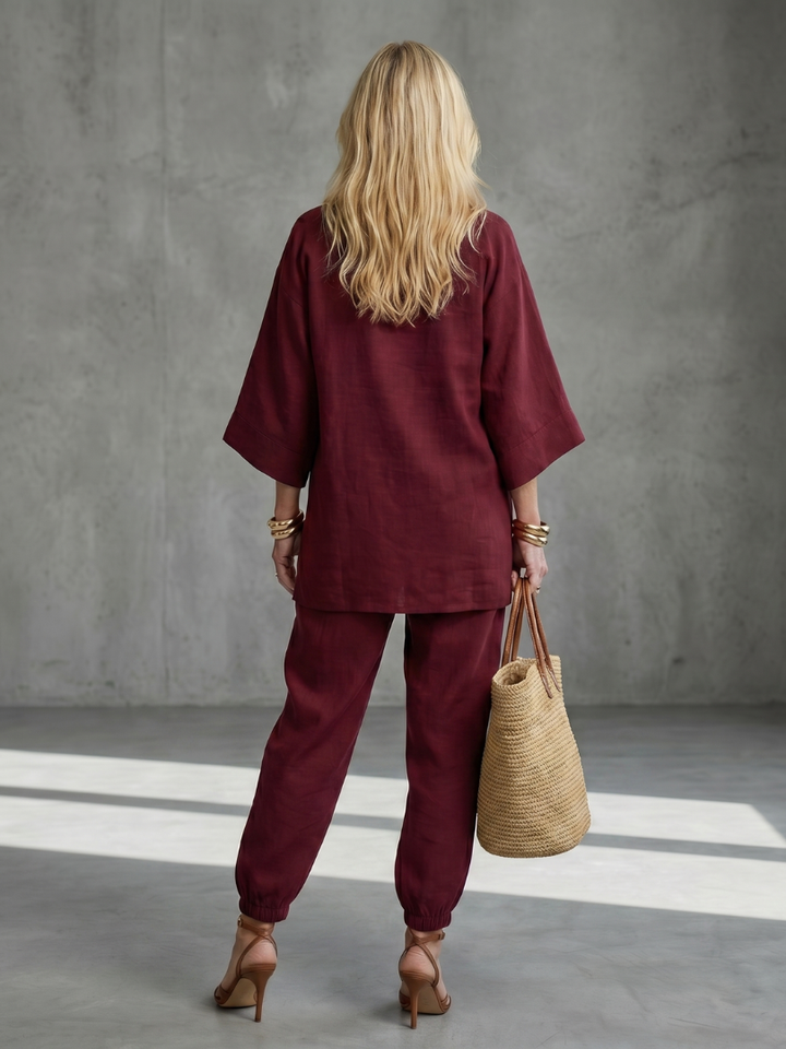 Summer outfit: Women's relaxed V-neck tunic & wide-sleeve gathered trouser set.