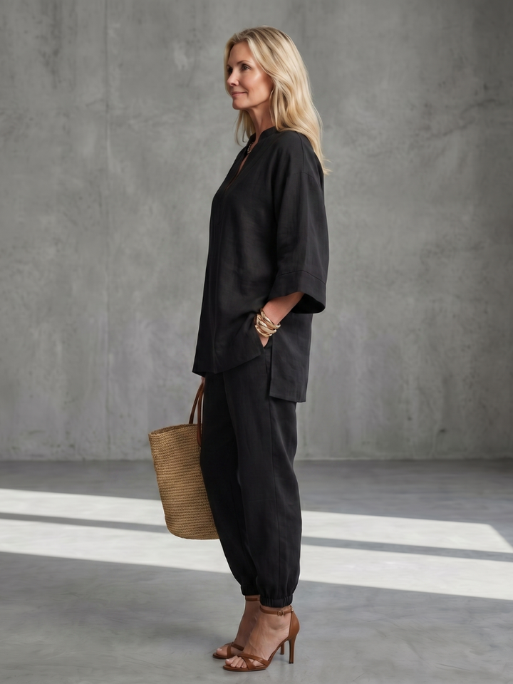 Coordinated women's V-neck tunic and gathered trouser set, ideal for casual wear.