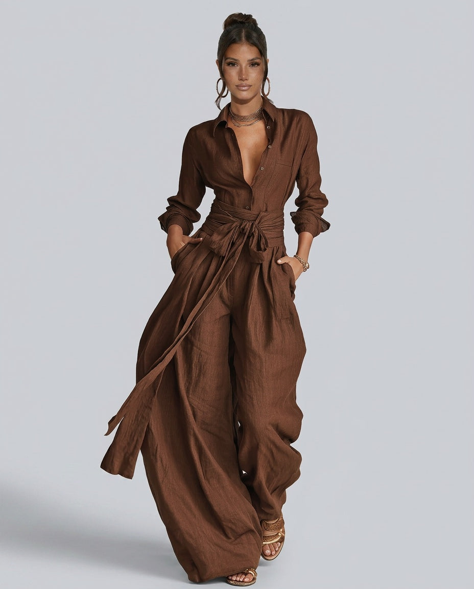Woman wearing a relaxed wide leg button-front jumpsuit, styled for a casual summer day.