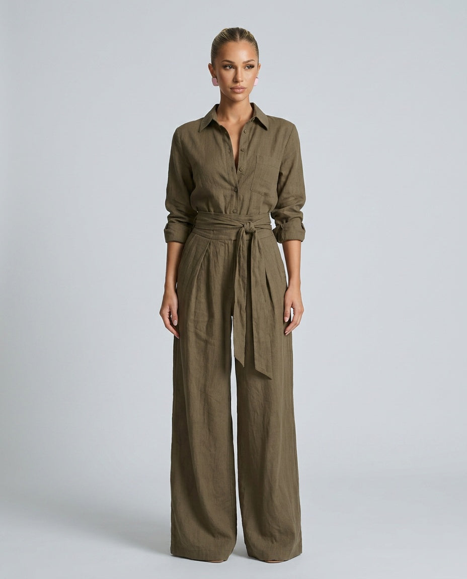 Stylish women's button-front wide leg jumpsuit in a solid color, perfect for spring fashion.