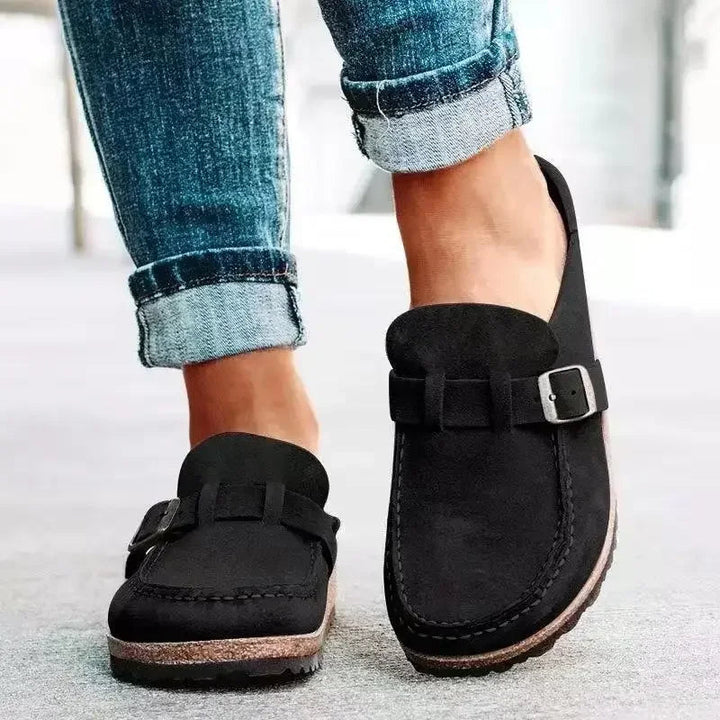Chic women's flat mules with retro buckle detail, easy slip-on style for everyday comfort.