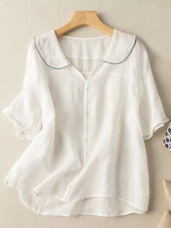 Elegant women's vintage style doll collar short sleeve shirt. Breathable, comfortable for ladies' summer fashion.