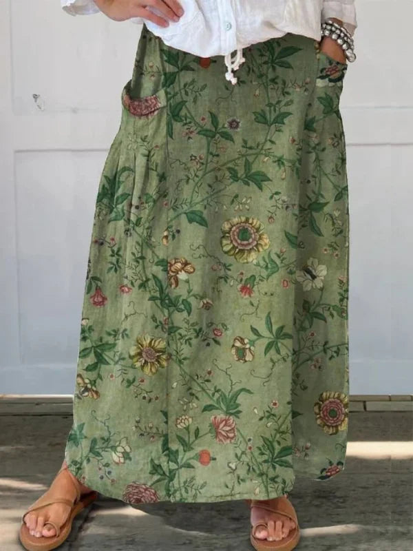 Women's retro floral maxi skirt in green with elastic waist, A-line cut, and patch pockets, perfect for summer casual wear.
