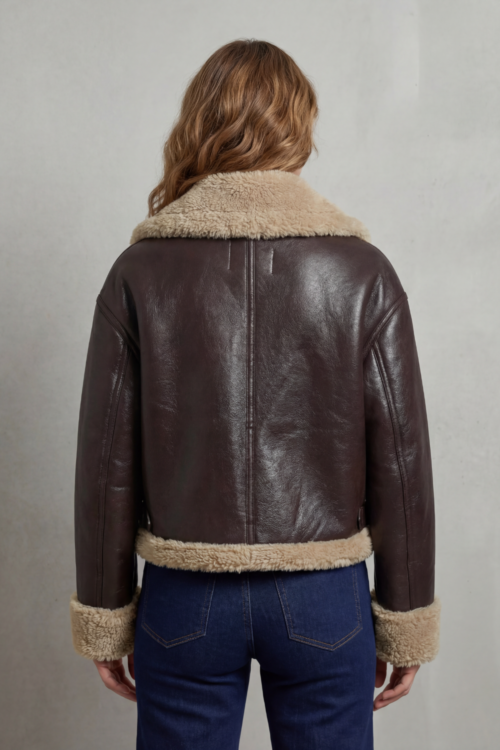 Stylish women's cropped jacket, aviator style, featuring a reversible design for diverse outfits.