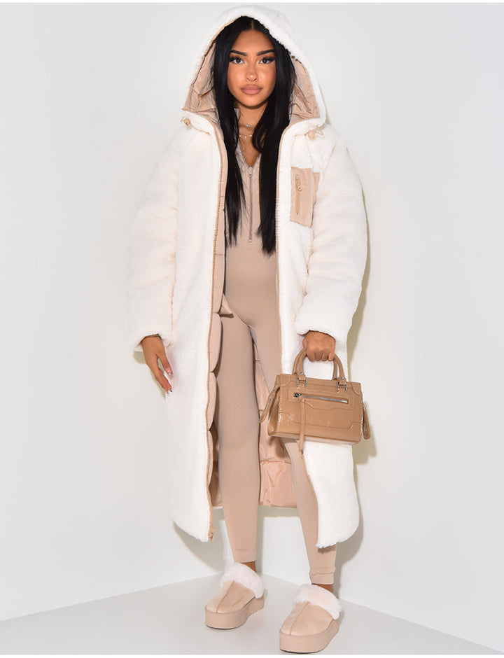 Hooded women's reversible long puffer jacket for ultimate winter warmth and versatile everyday wear.