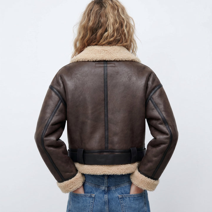 Cozy double-sided reversible women's bomber jacket. Warm shearling winter coat, stylish and comfortable fashion.