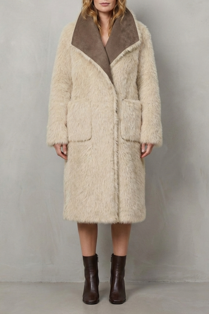 Textured reversible women's winter coat, offering warmth and two stylish looks for cold weather.