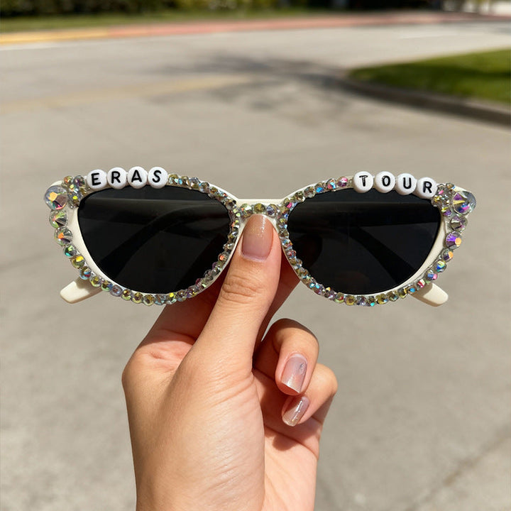 Women's rhinestone cat-eye sunglasses with UV protection for a glamorous look.