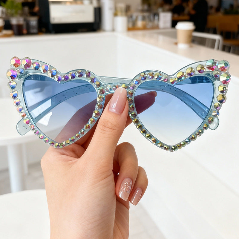 Women's fashionable heart sunglasses, rhinestone accents, ideal UV summer eyewear for events.
