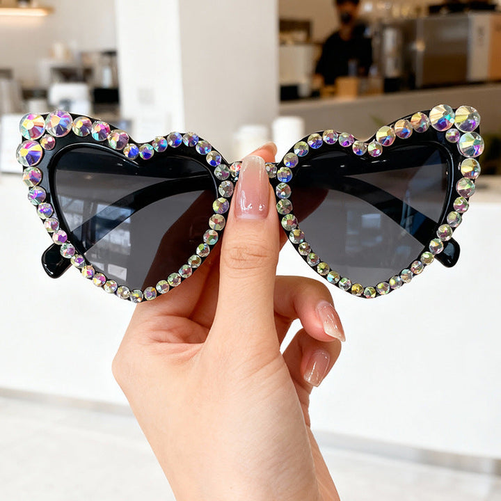 UV protective women's heart sunglasses, shimmering rhinestones, a unique fashion statement.