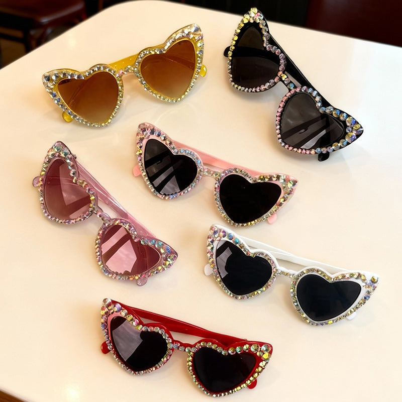 Glamorous rhinestone heart sunglasses for women, essential UV protection eyewear.