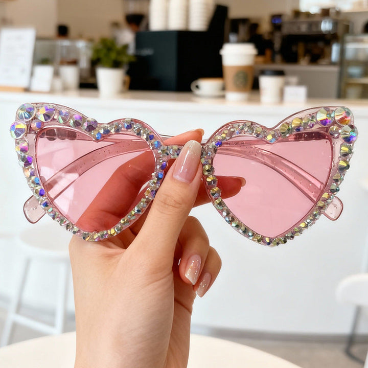Chic women's heart rhinestone sunglasses, perfect UV protected eyewear for summer.