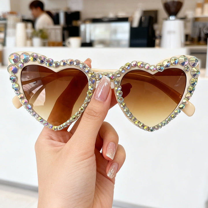 Sparkling rhinestone heart sunglasses for women, offering complete UV protection for eyes.