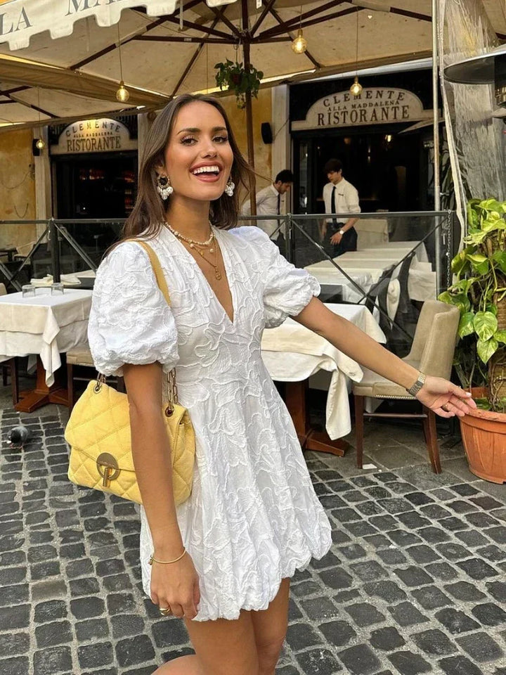Women's romantic floral mini dress, perfect for summer elegance. Features delicate floral print and comfortable fit.