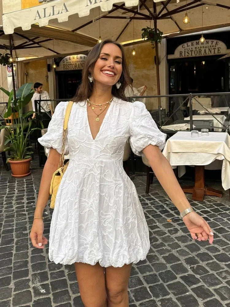Romantic women's floral mini dress, an elegant summer day dress. Perfect vacation outfit with a chic, flowy style.