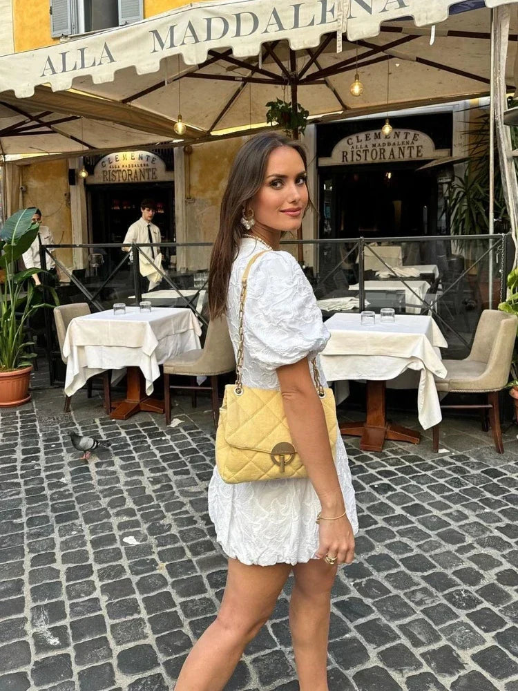Women's floral puff sleeve mini dress. Elegant and romantic summer fashion, suitable for a casual or day dress.