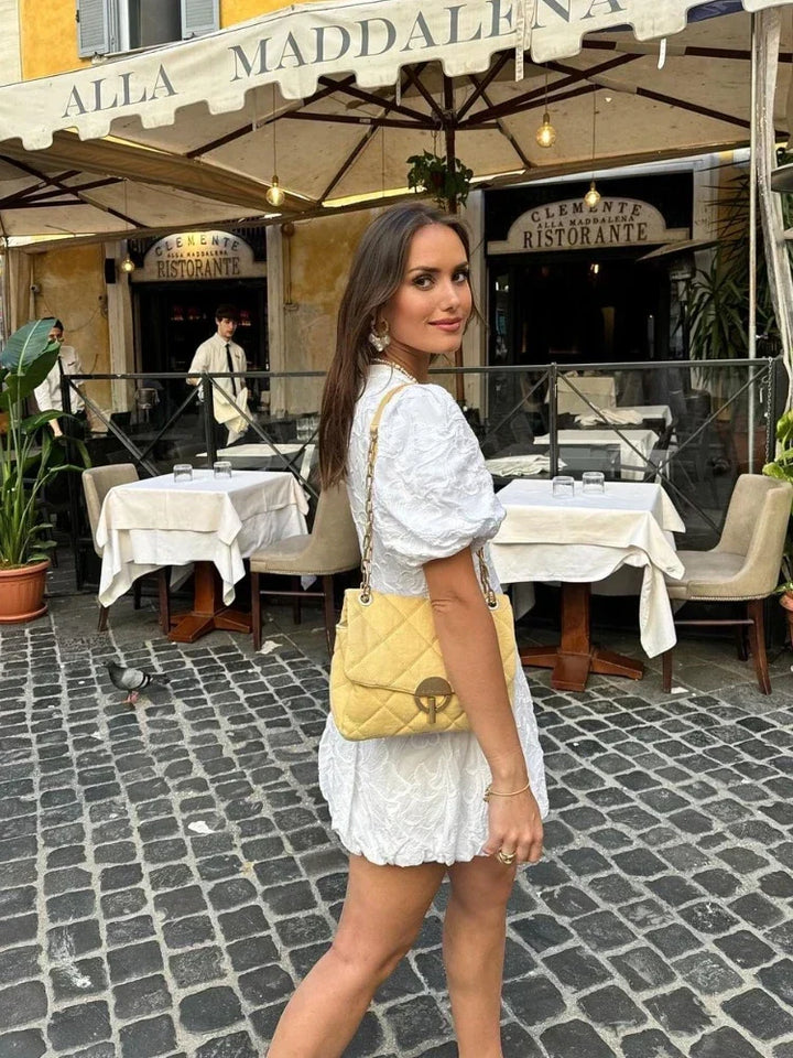 Women's floral puff sleeve mini dress. Elegant and romantic summer fashion, suitable for a casual or day dress.