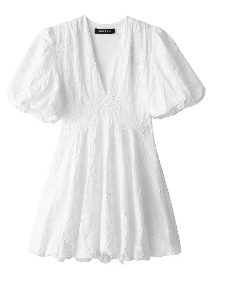 Effortlessly elegant women's floral mini dress for summer. Romantic style, perfect for warm weather day wear.