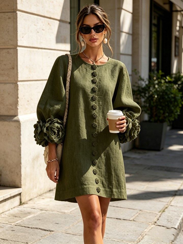 Spring fashion women's mini dress: round neck, long sleeves & button front. Casual shift style.