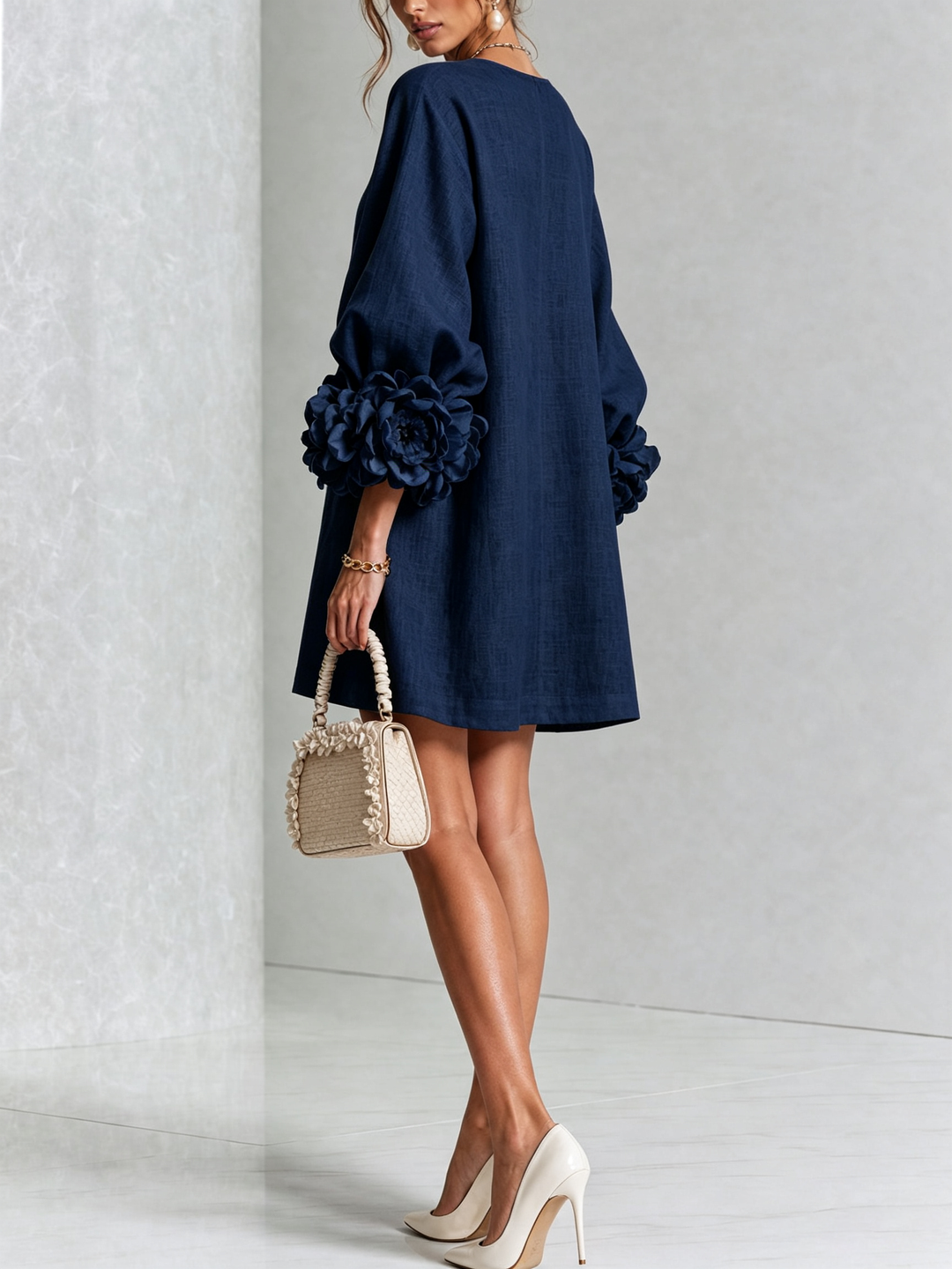 Floral print mini shift dress with voluminous long sleeves and button-down front.