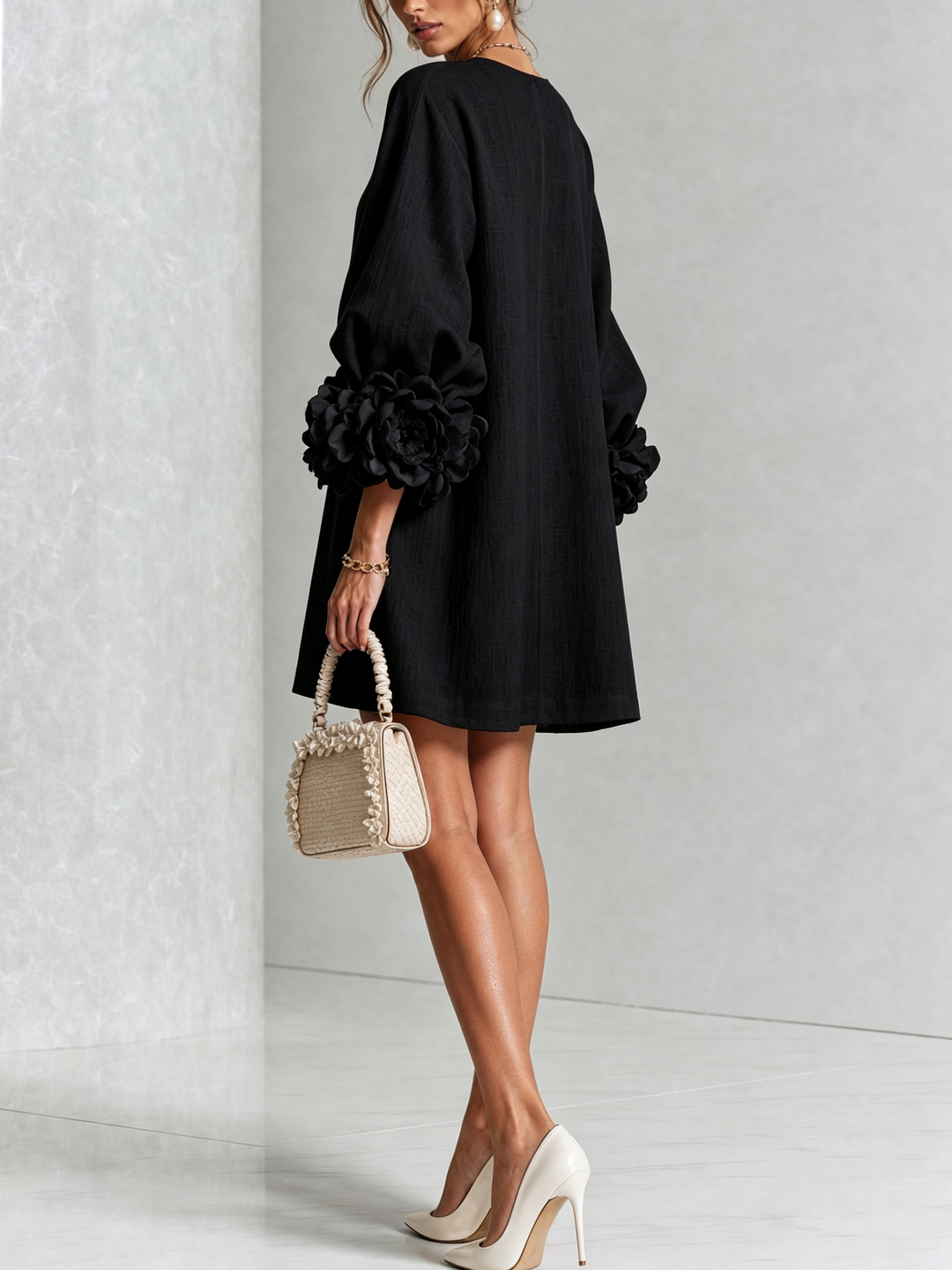 Casual spring long sleeve mini dress, round neck, floral accents & a comfortable shift fit.