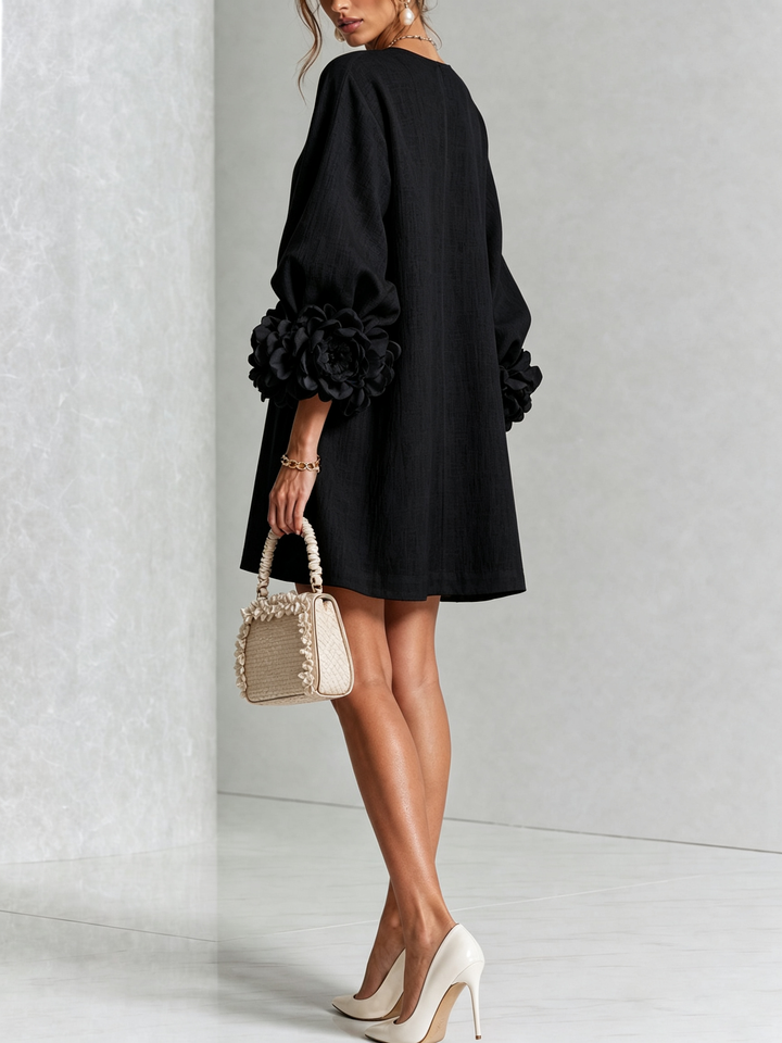 Casual spring long sleeve mini dress, round neck, floral accents & a comfortable shift fit.