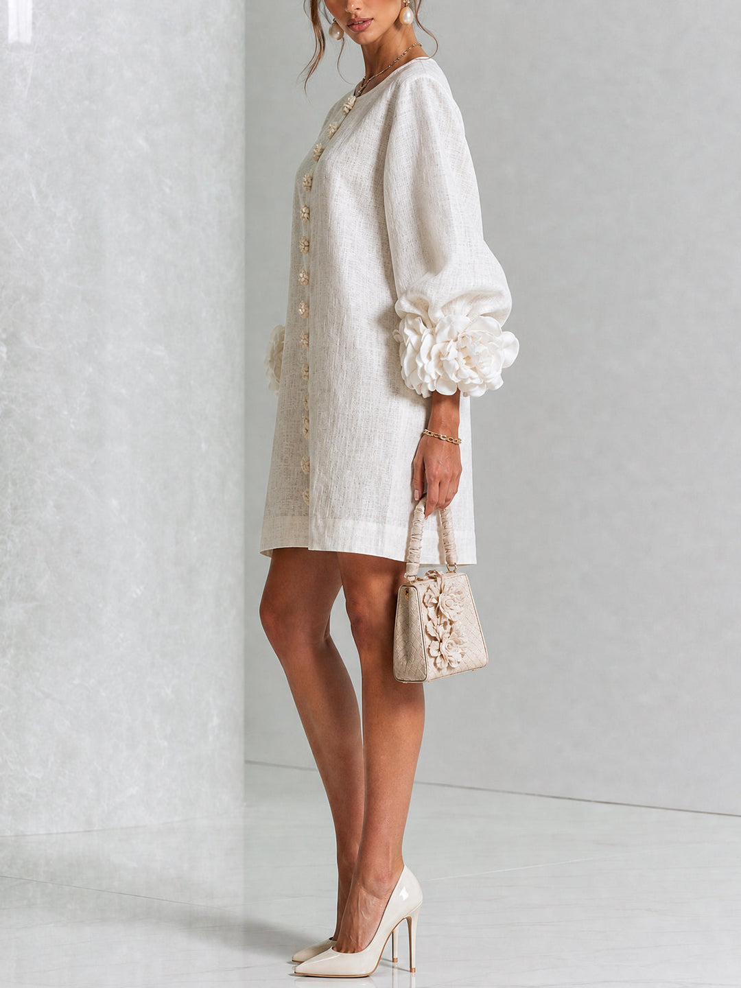 Floral detail mini shift dress with a round neck and long voluminous sleeves.