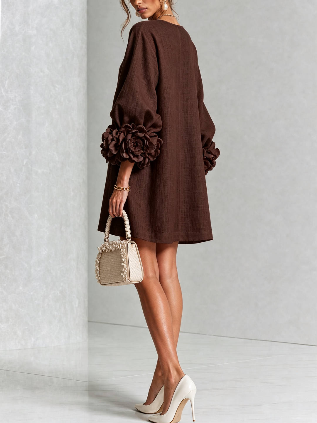 Women's elegant long sleeve mini dress, round neck, with a flowy A-line shift silhouette.