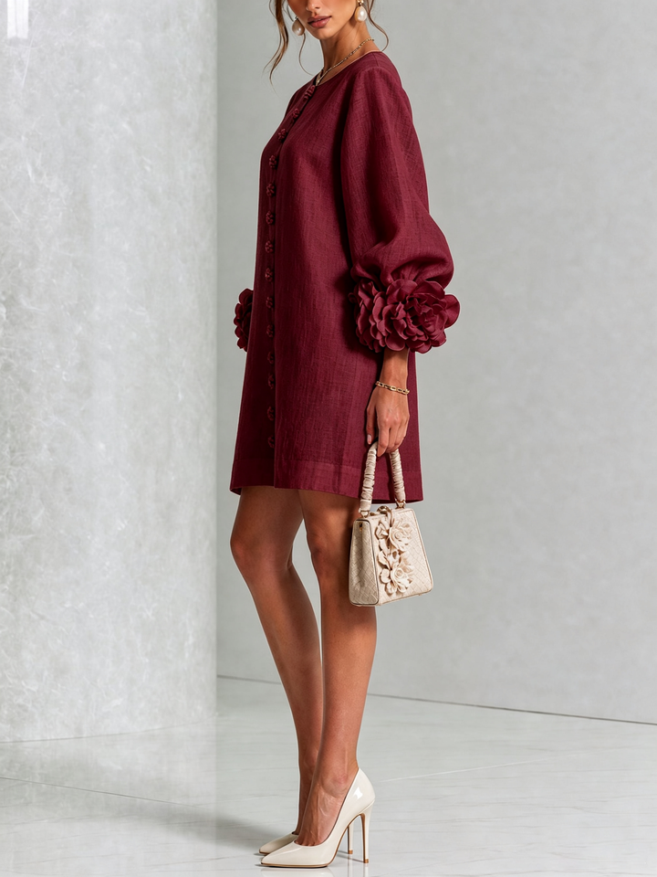 Women's button front mini shift dress, long sleeve, round neck, flattering A-line fit.