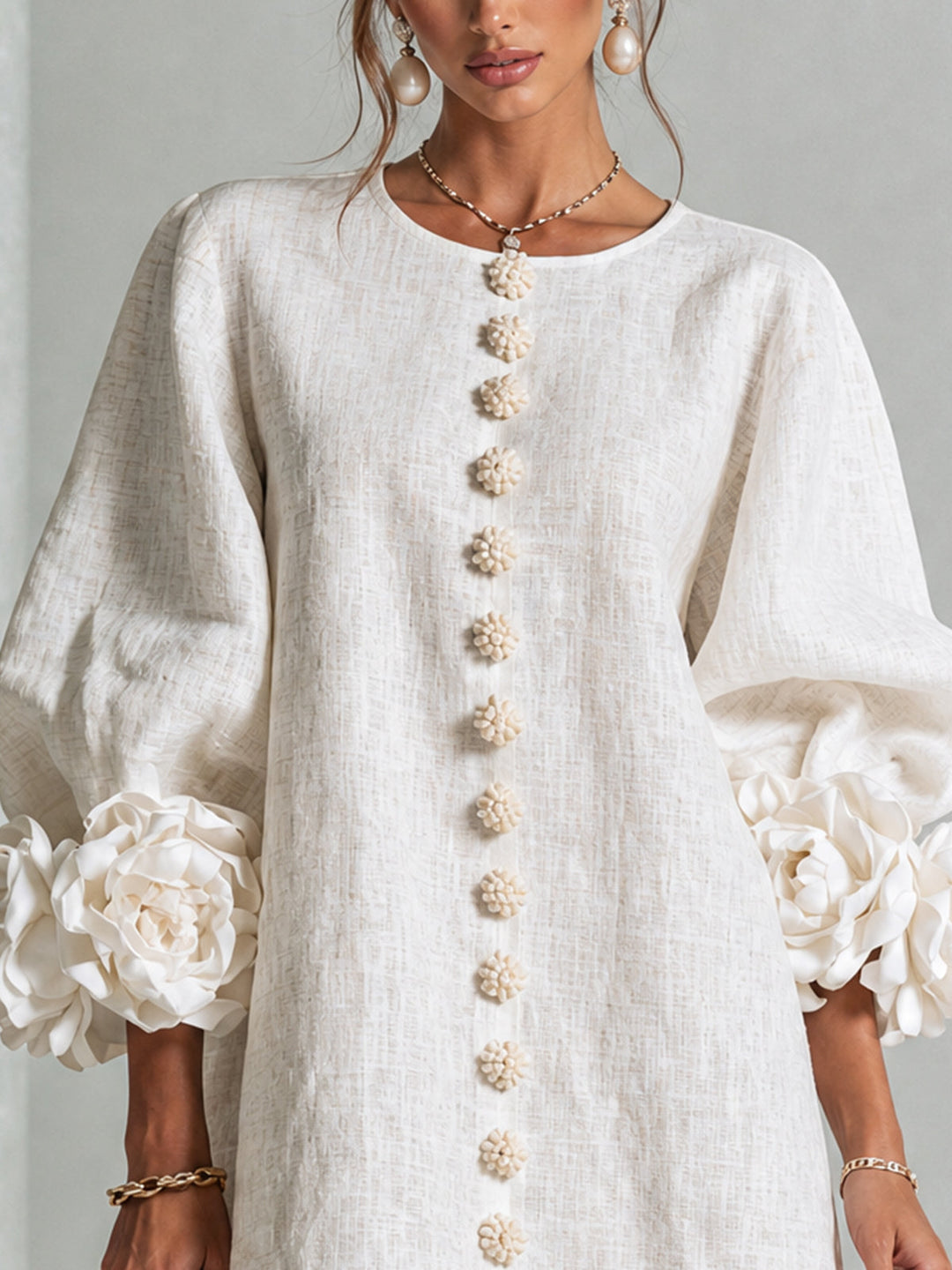 Elegant round neck mini shift dress with full length sleeves & subtle floral design.