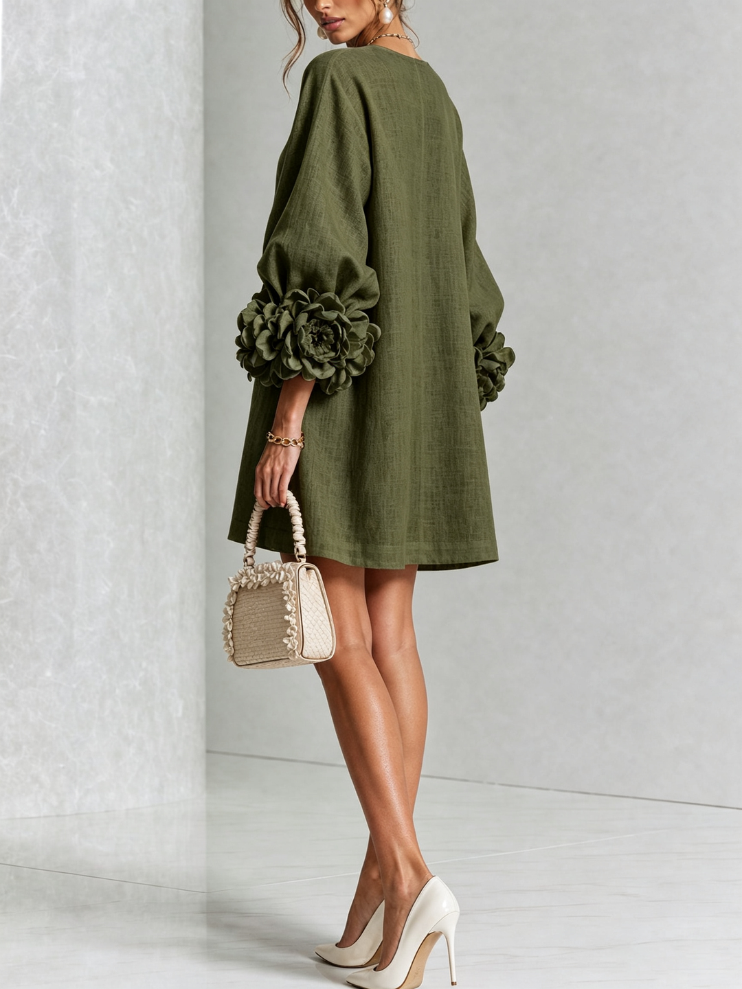 Comfortable women's mini shift dress with long sleeves, round neck & charming floral details.