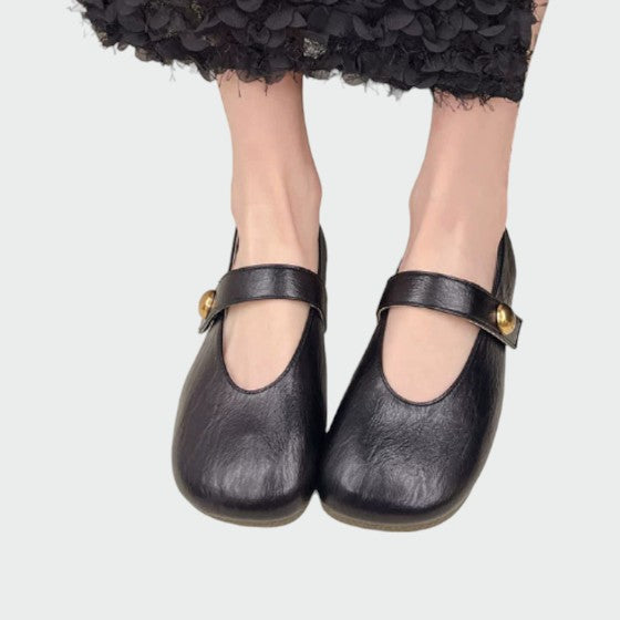 Women's round-toe Mary Jane shoes with button detail & block heel, offering all-day comfort.
