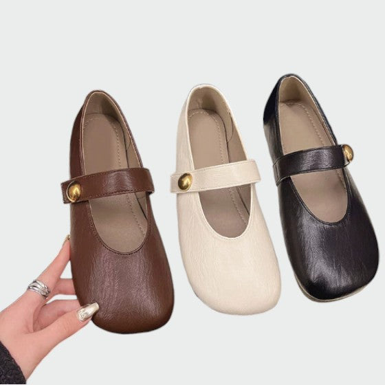 Elegant two-tone Mary Jane women's shoes, classic round-toe, adjustable strap & comfy block heel footwear.