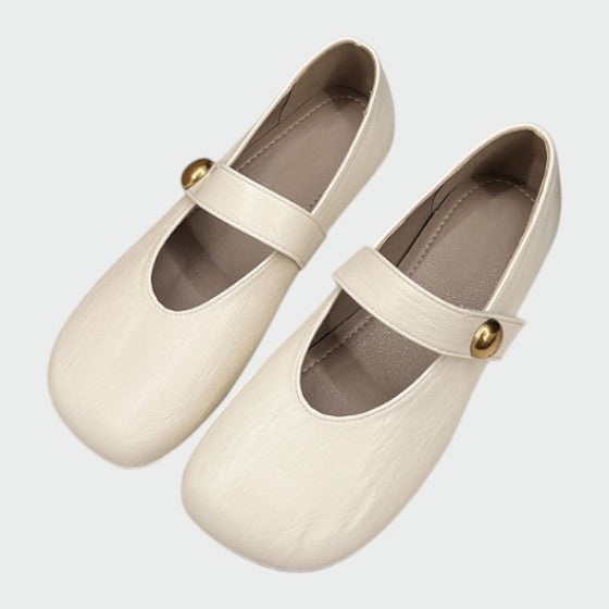 Comfortable women's Mary Jane footwear, round toe, stylish button detail, stable block heel, classic.