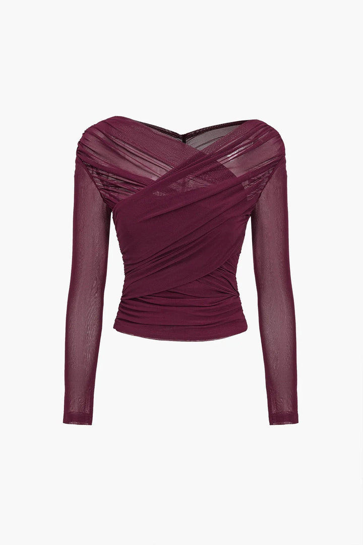 Elegant women's ruched long sleeve top with a unique cross-front detail, ideal for evening wear.