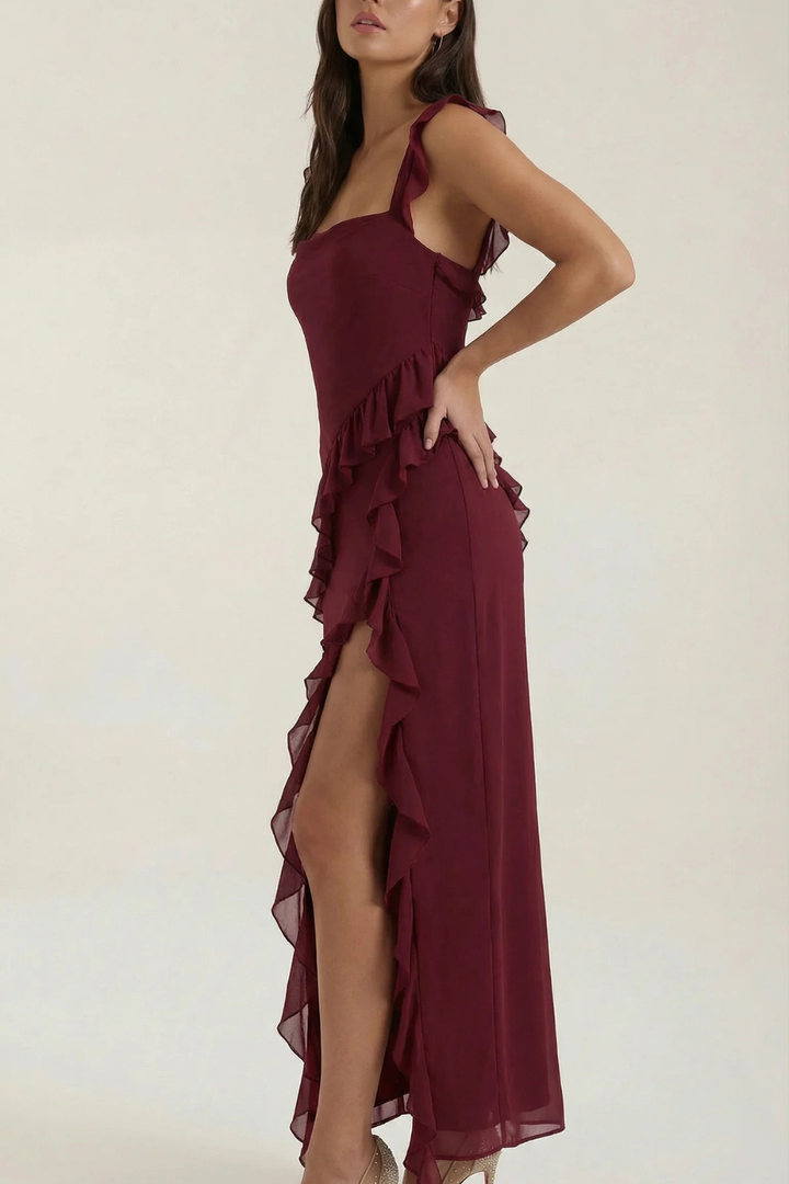 Modern women's ruffle dress, knee-length with an elegant side slit, sophisticated & semi-formal.