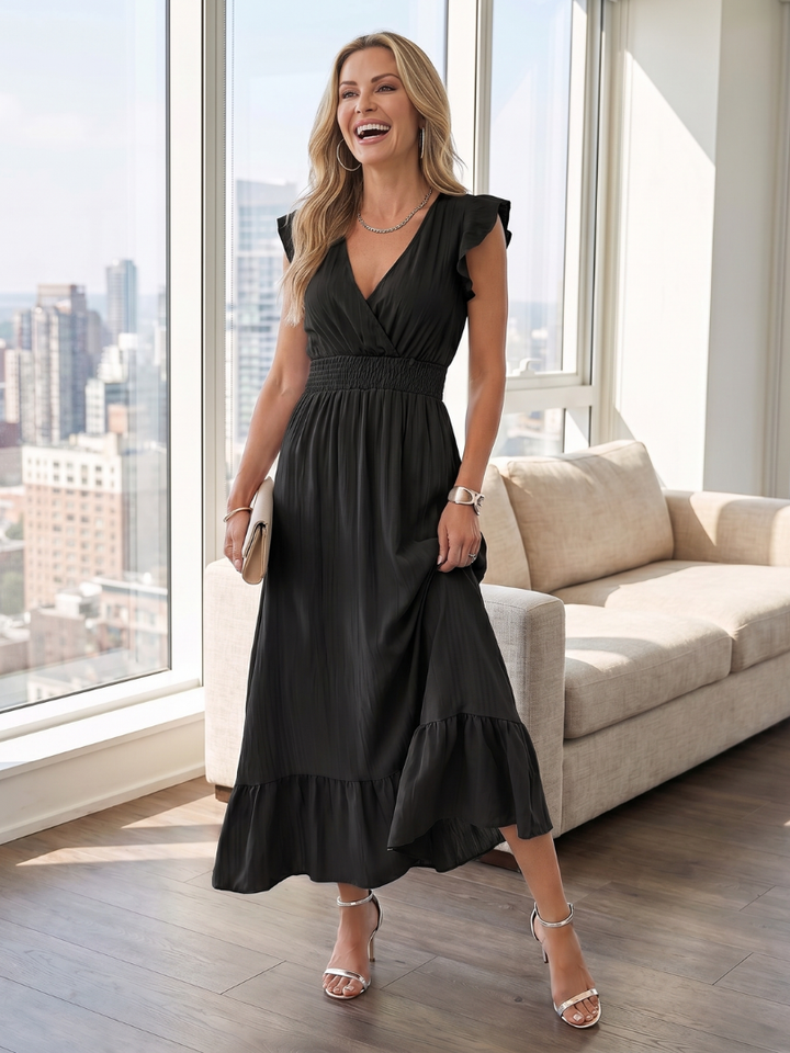 Pretty women's midi dress with delicate ruffle sleeves and a flattering smocked waist detail.