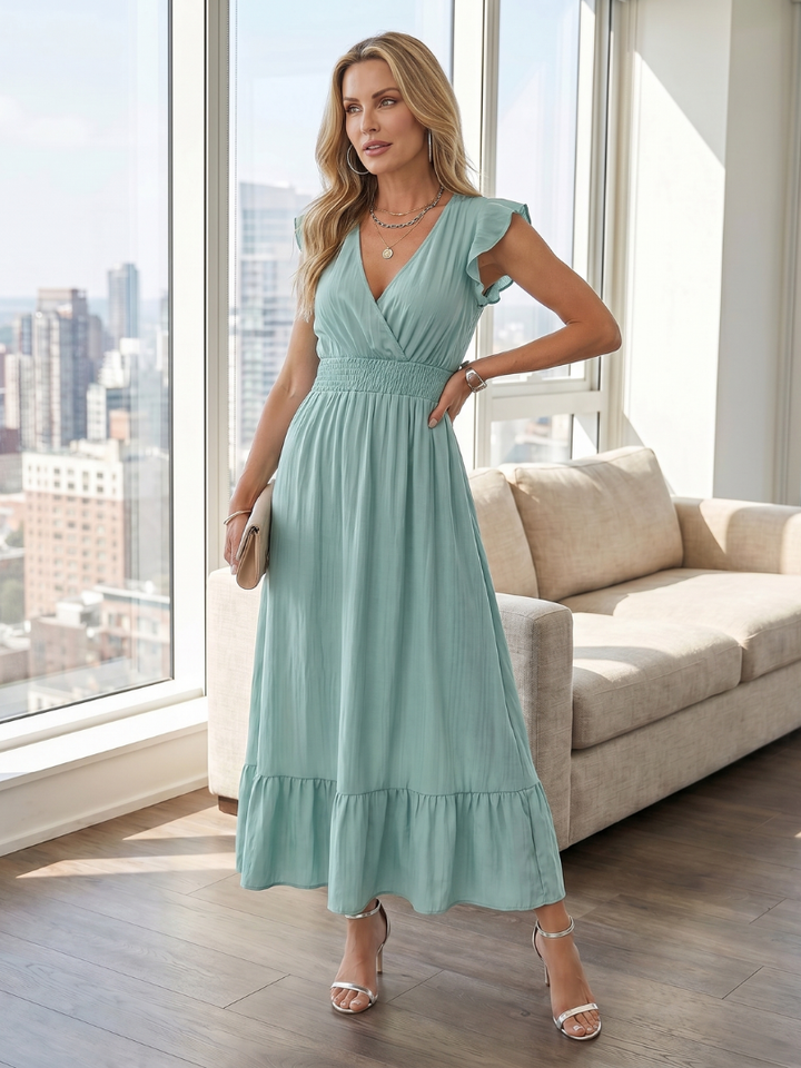 Elegant women's tiered midi dress with ruffle sleeves, v-neck, and comfortable smocked waist.