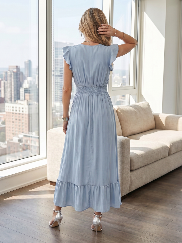 Stylish women's midi dress, comfortable with ruffle sleeves, smocked waist, and tiered skirt.