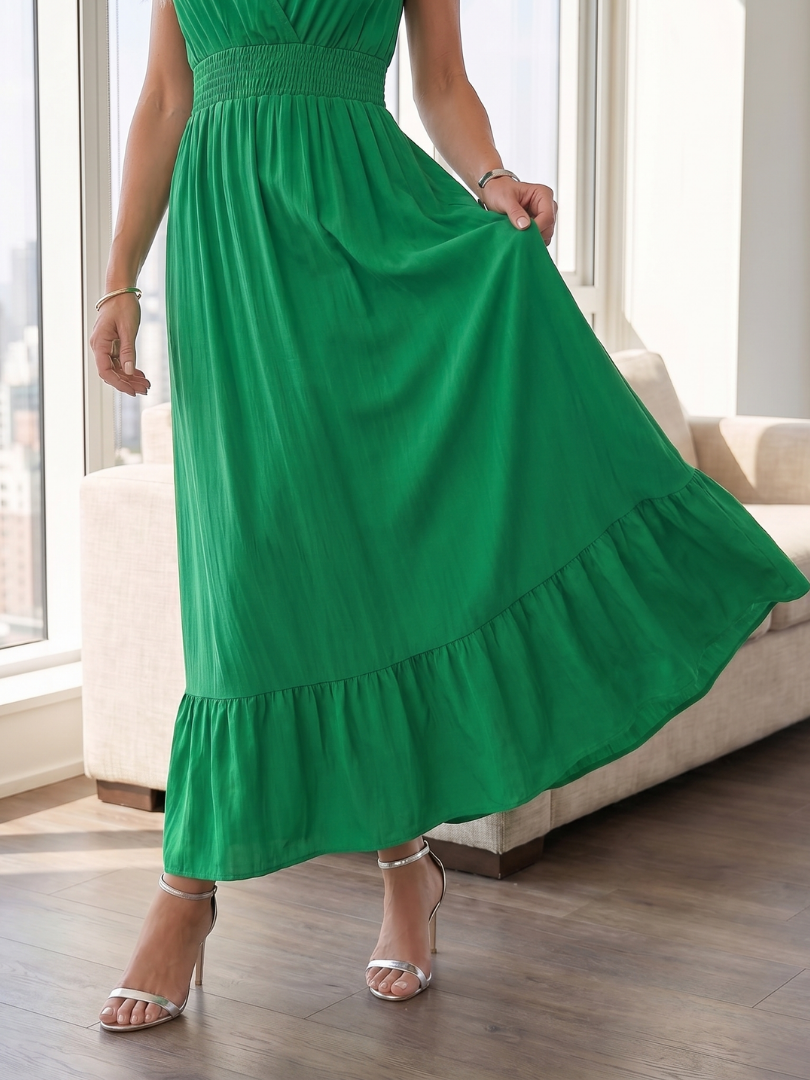 Chic women's casual midi dress featuring ruffle sleeves, smocked waist, and elegant tiered skirt.