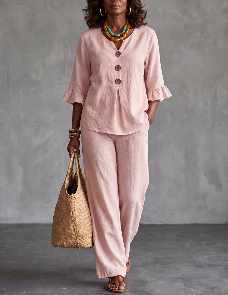 Comfortable wide leg trousers paired with a chic ruffle sleeve top, a women's co-ord set for effortless style.